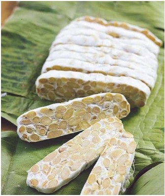 Tempeh soaked and cooked soybeans inoculated with a mold